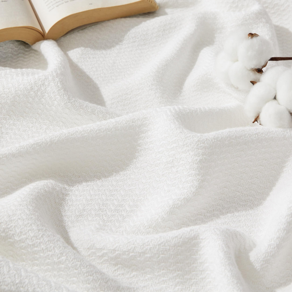 Bedsure blanket front view showing clean white herringbone texture and elegant drape