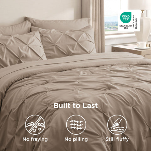 Bedsure comforter on bed with person to show king-size scale and generous coverage