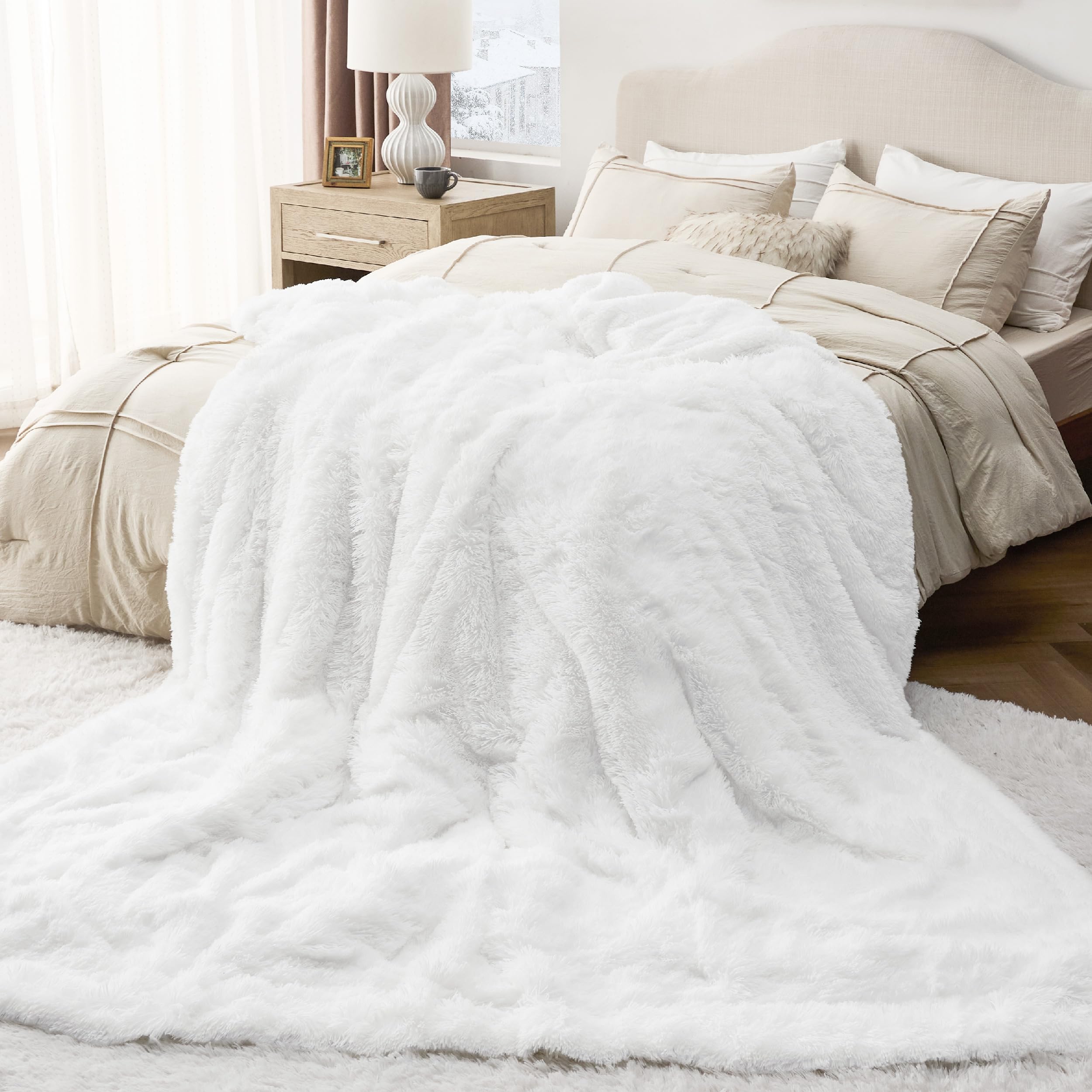 Bedsure blanket draped over sofa adding style and comfortable seating