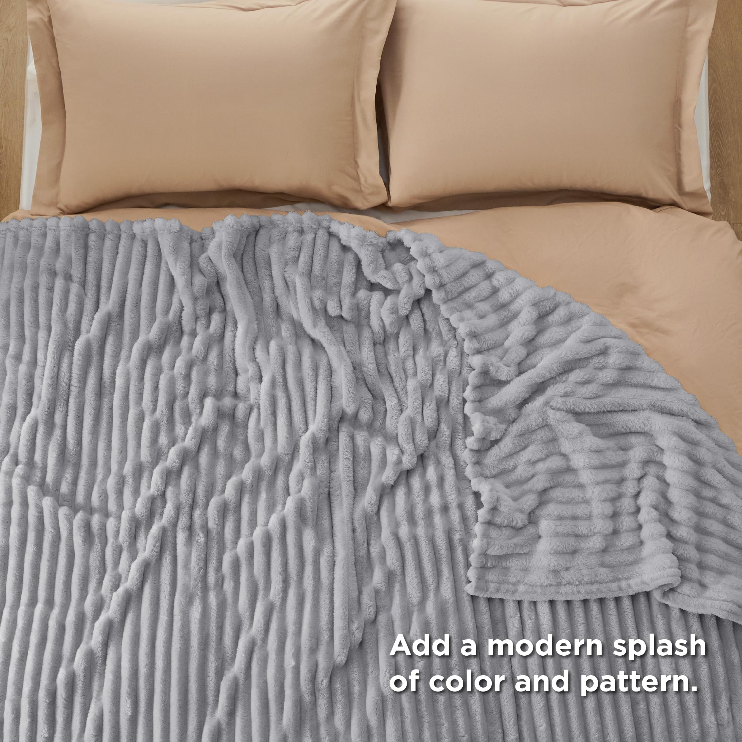 Bedsure blanket draped on couch illustrating versatile use for lounging benefit