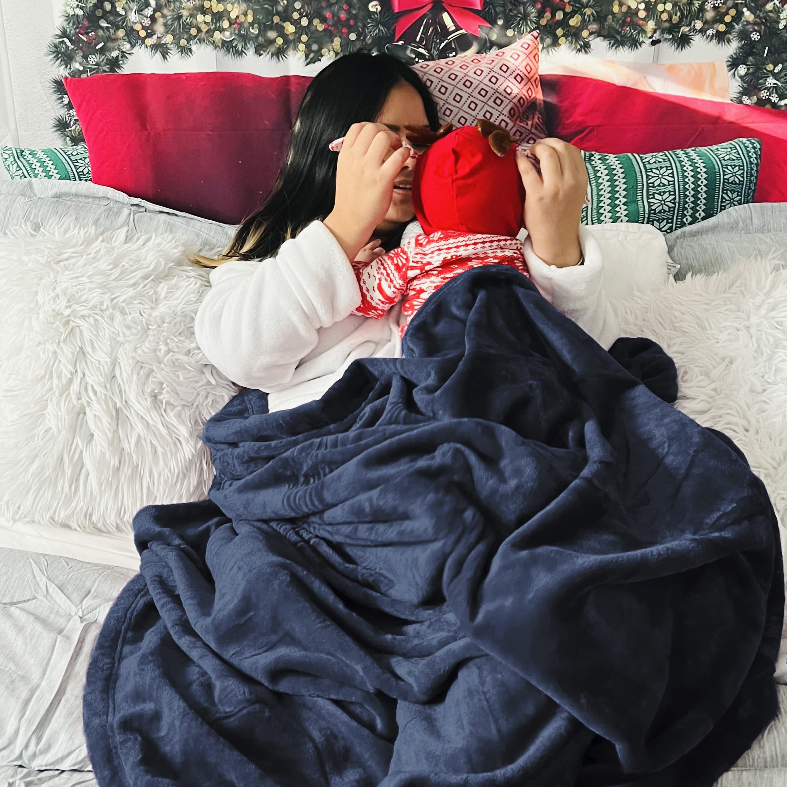 Bedsure navy blanket draped over sofa for comfortable living room use