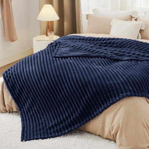 Bedsure navy blanket size comparison on chair showing scale and generous coverage
