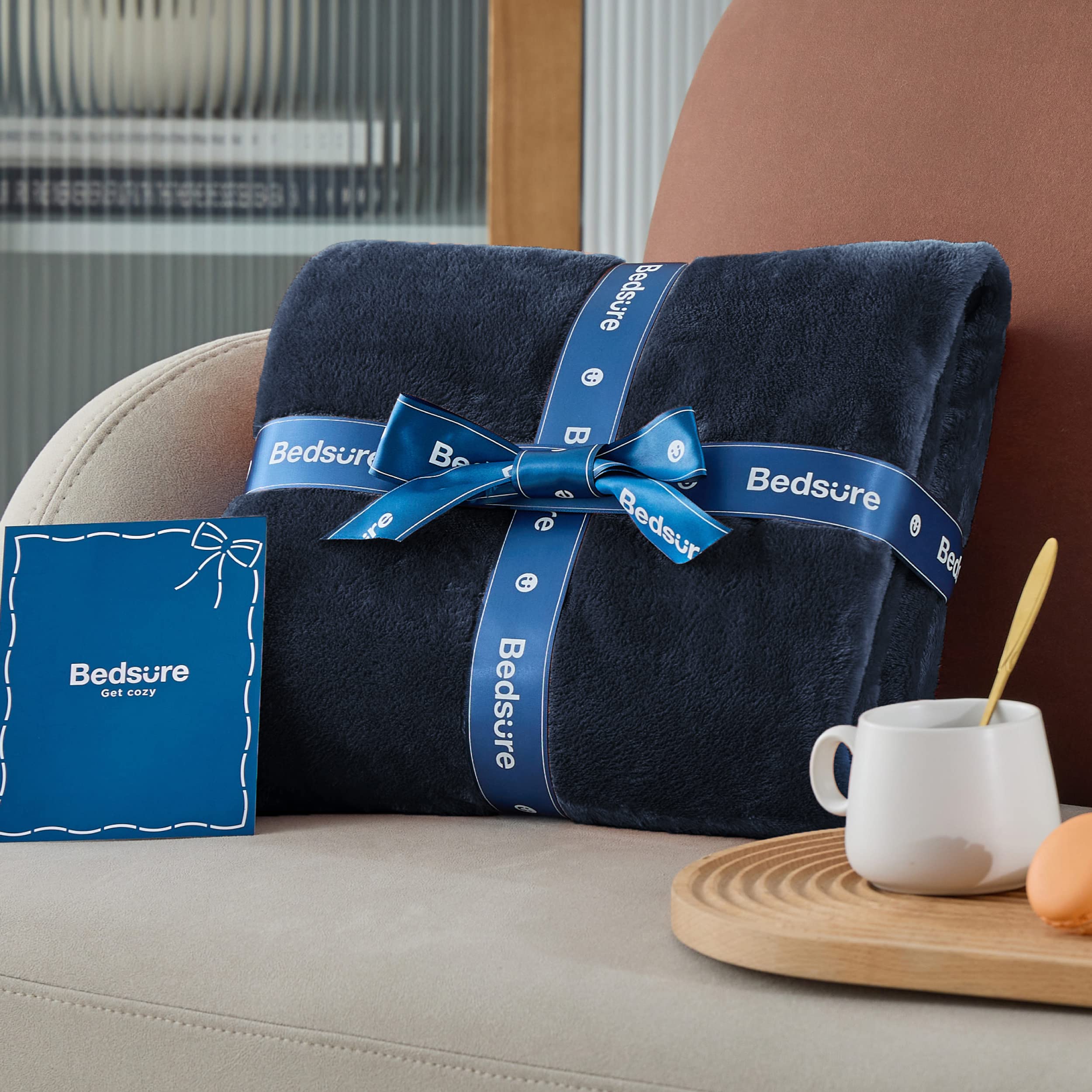 Bedsure navy blanket next to ruler emphasizing 60x80 twin dimensions