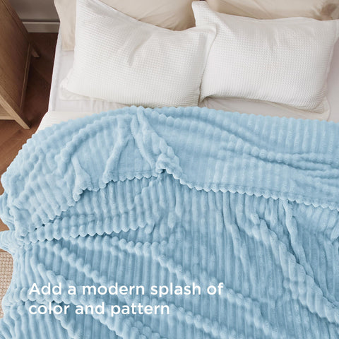 Bedsure blanket draped over queen bed displaying cozy coverage and decor appeal