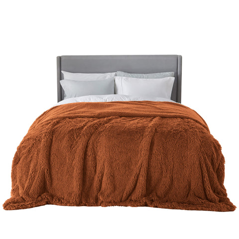 Bedsure orange faux fur blanket front view shows plush look and decorative appeal