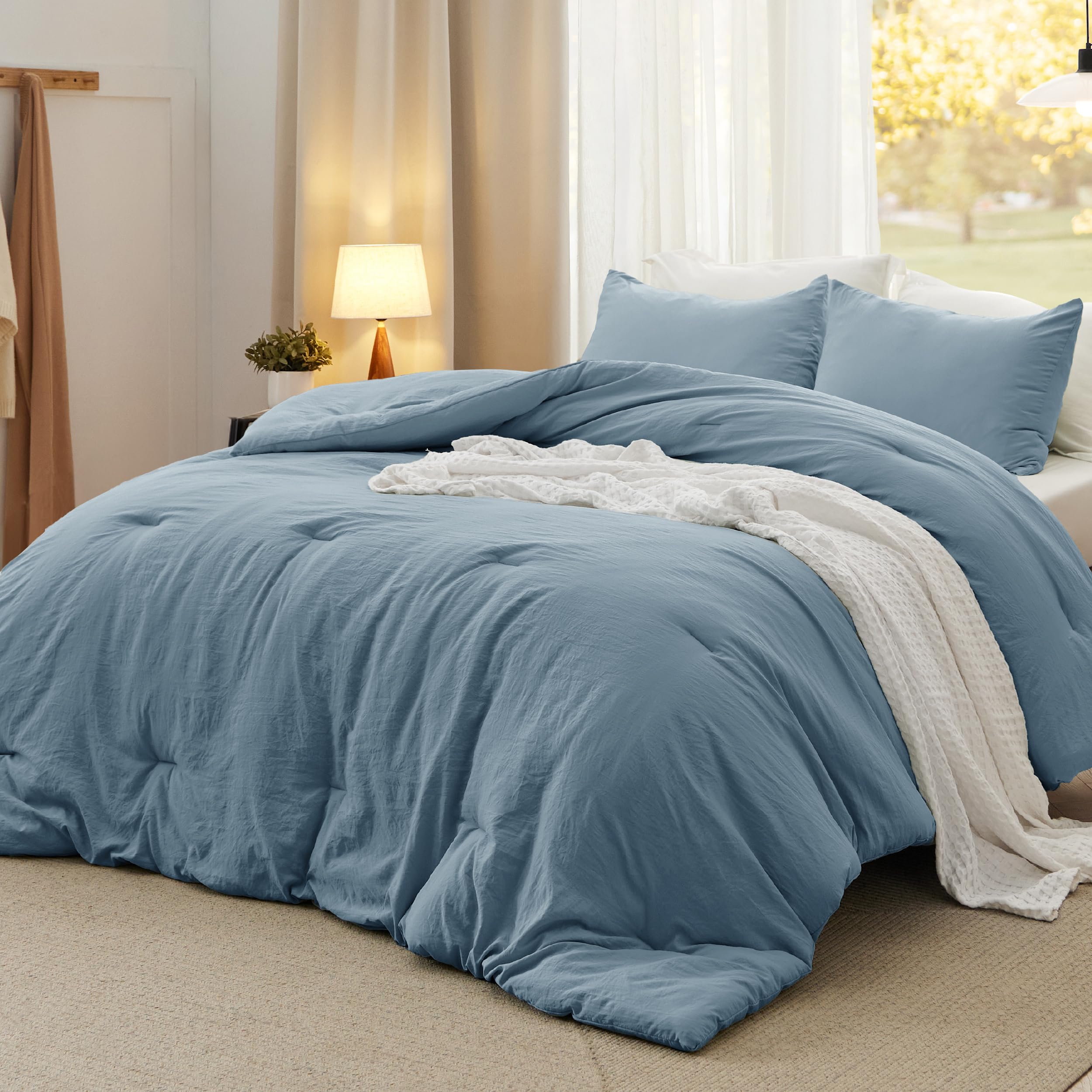Bedsure oversized king comforter front view showing full dusty blue coverage benefit: generous fit
