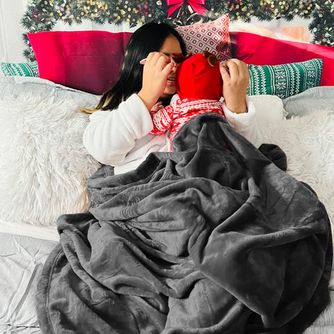 Bedsure person lounging on sofa using blanket for comfortable relaxation
