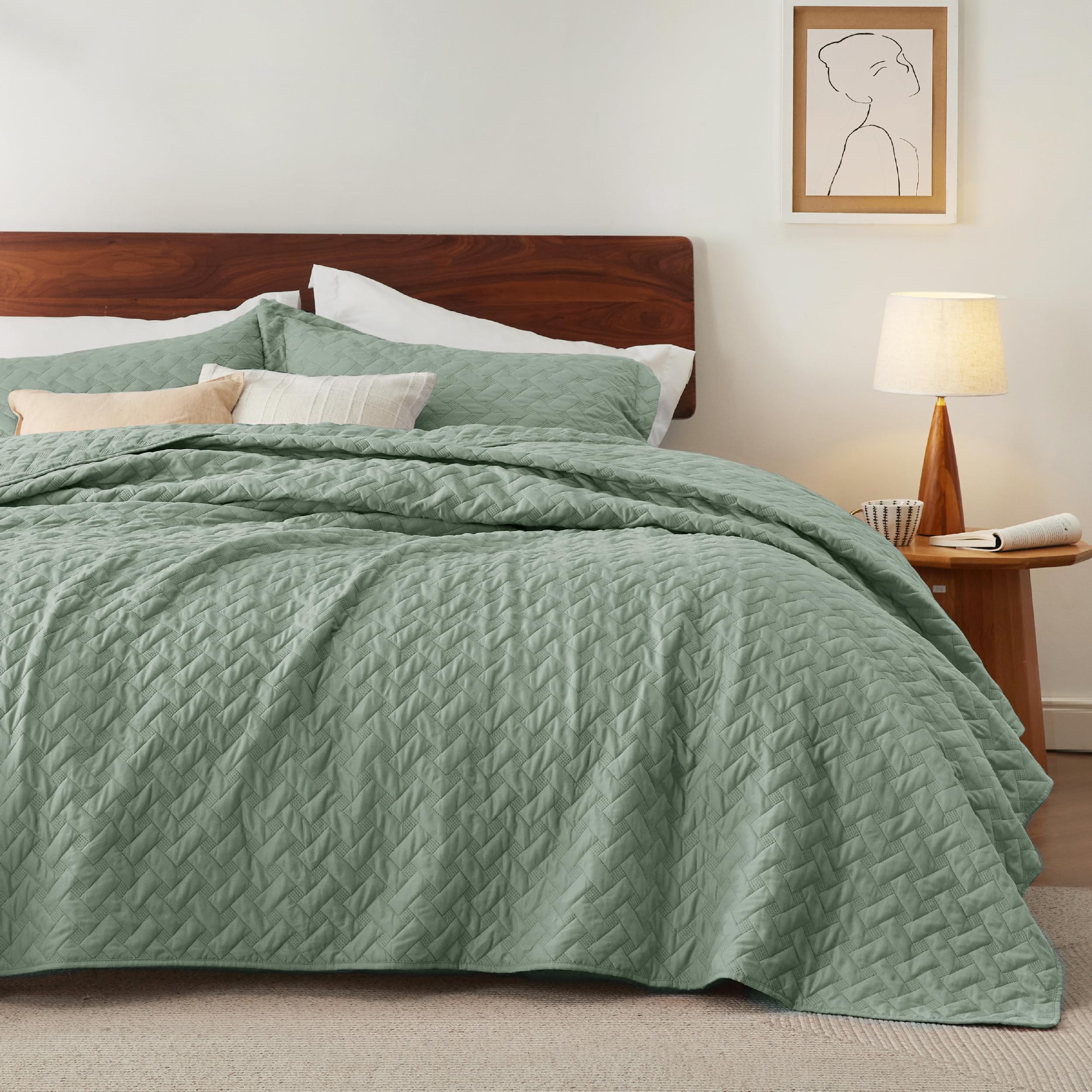 Bedsure folded quilt beside ruler showing queen dimensions and generous coverage