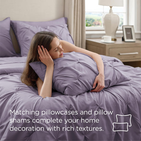 Bedsure hand compressing comforter to show lightweight loft and warmth