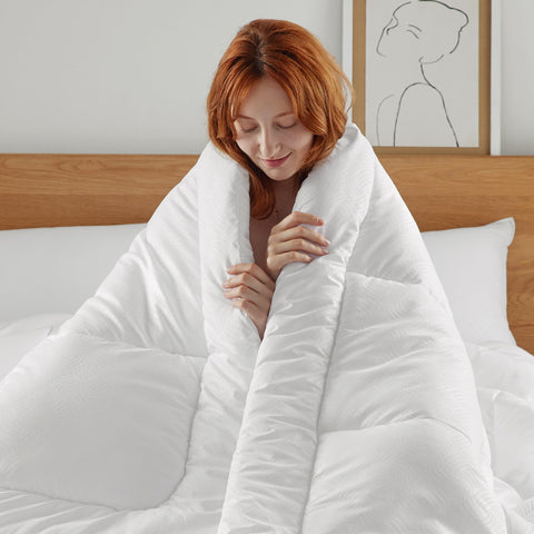 Bedsure comforter next to measuring tape to show 90x102 king scale