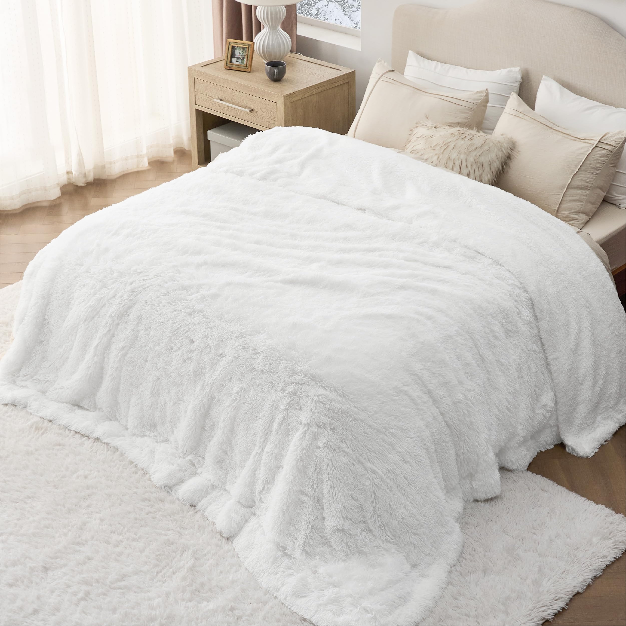 Bedsure alongside a pillow illustrating 60x80 size and scale for queen beds