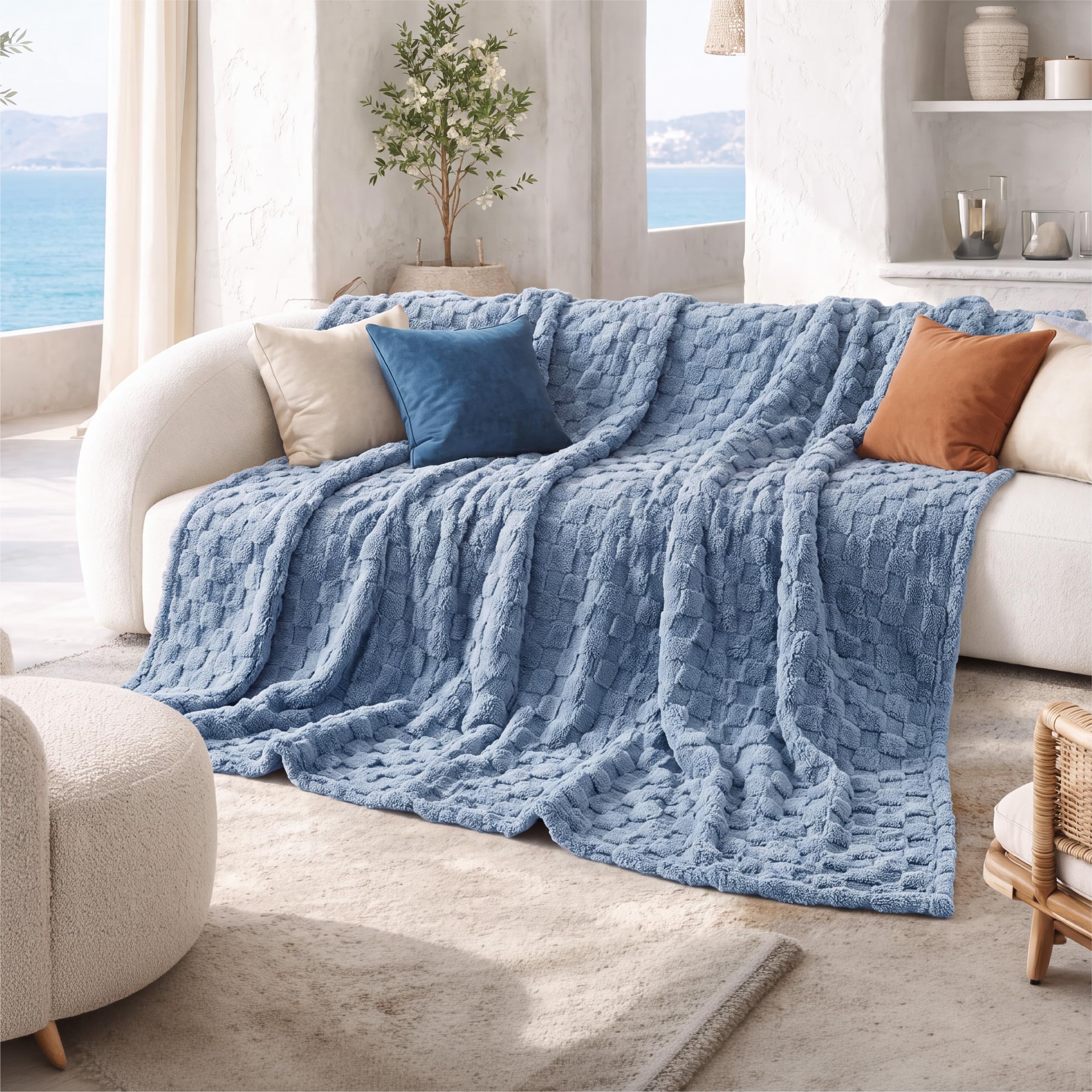 Bedsure blanket next to pillow showing size comparison and scale