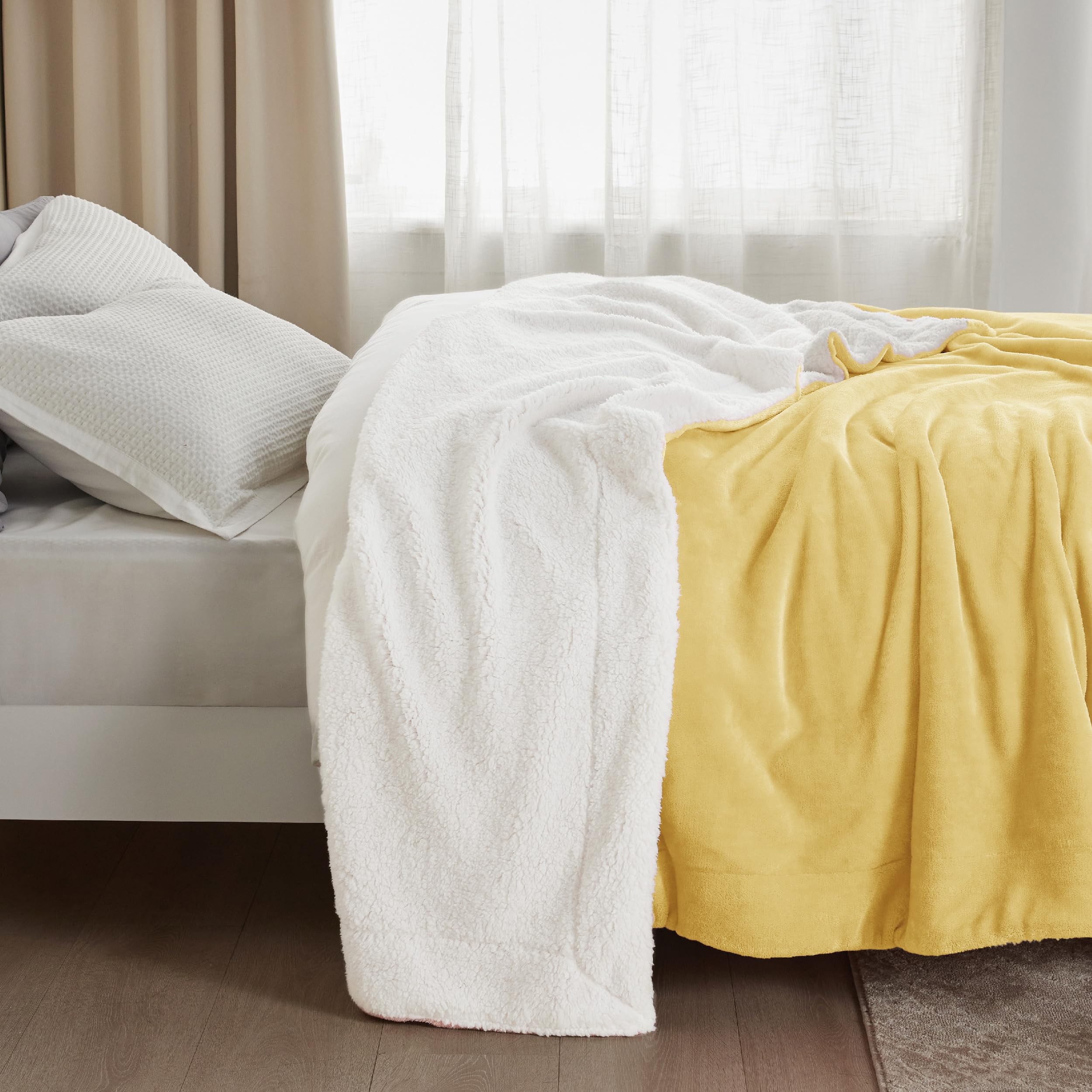 Bedsure blanket draped over person to show generous 90x90 scale