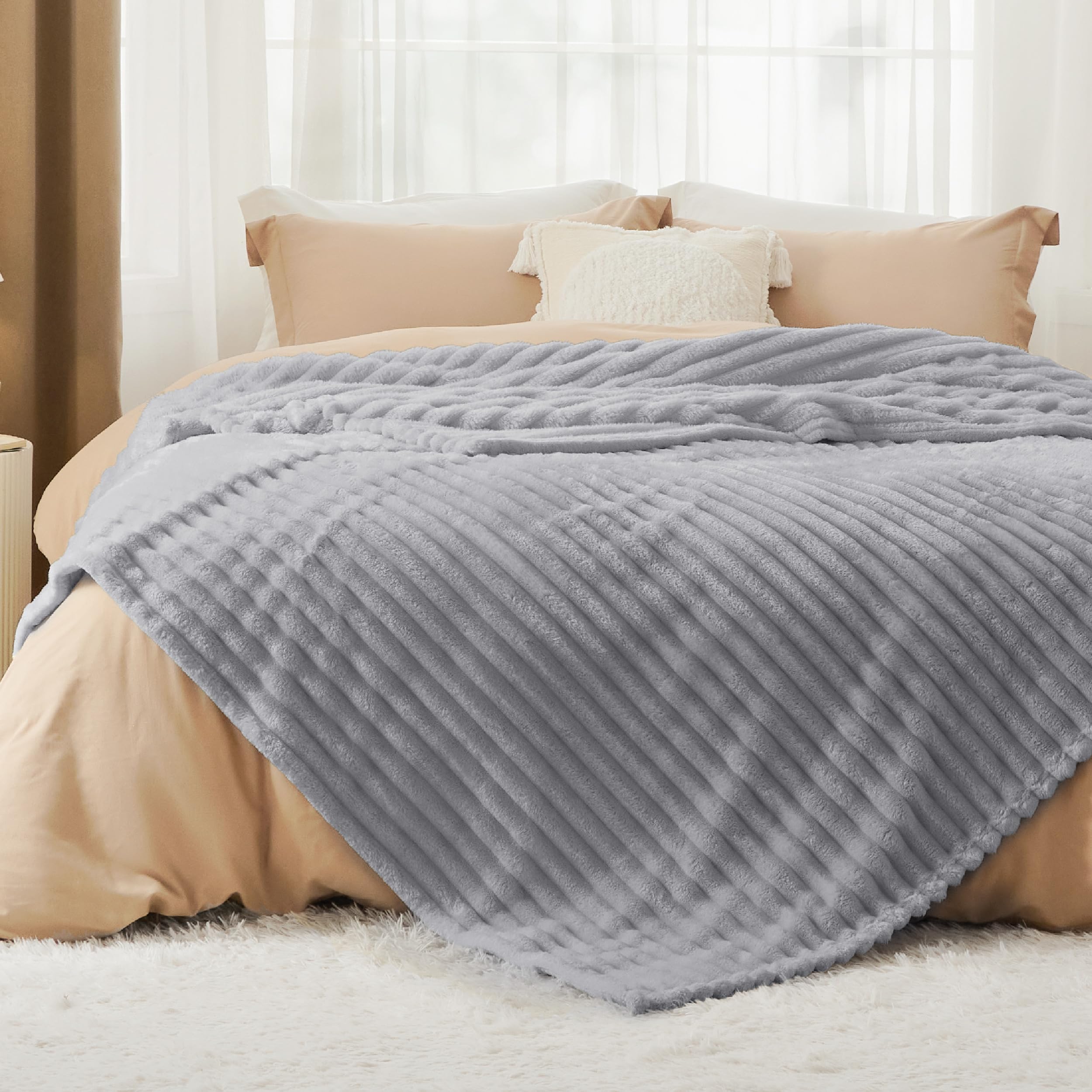 Bedsure close-up of striped flannel fleece texture highlighting plush softness benefit