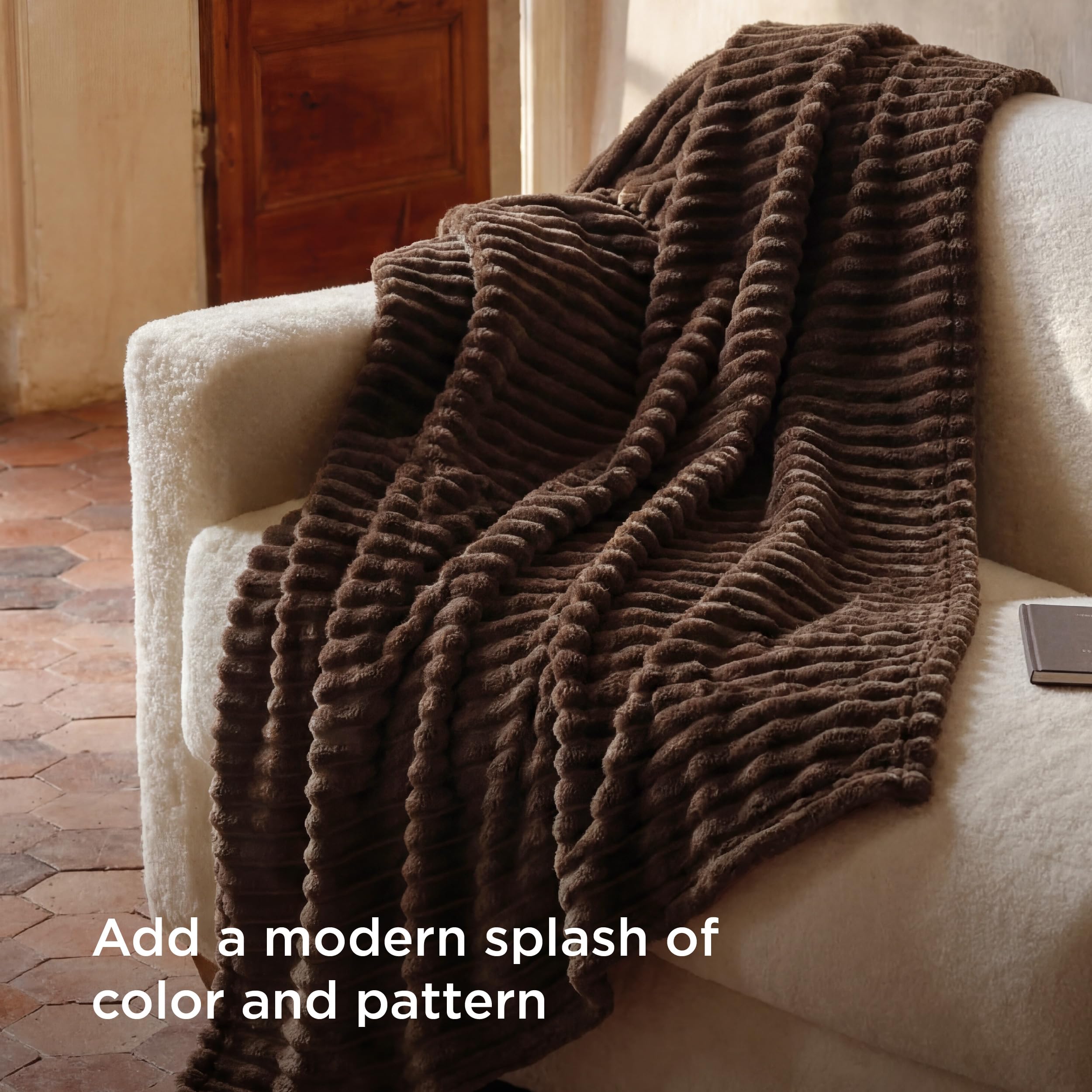 Bedsure draped over couch adding warmth and decorative accent to living room