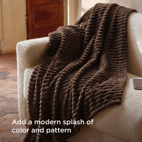 Bedsure draped over couch adding warmth and decorative accent to living room