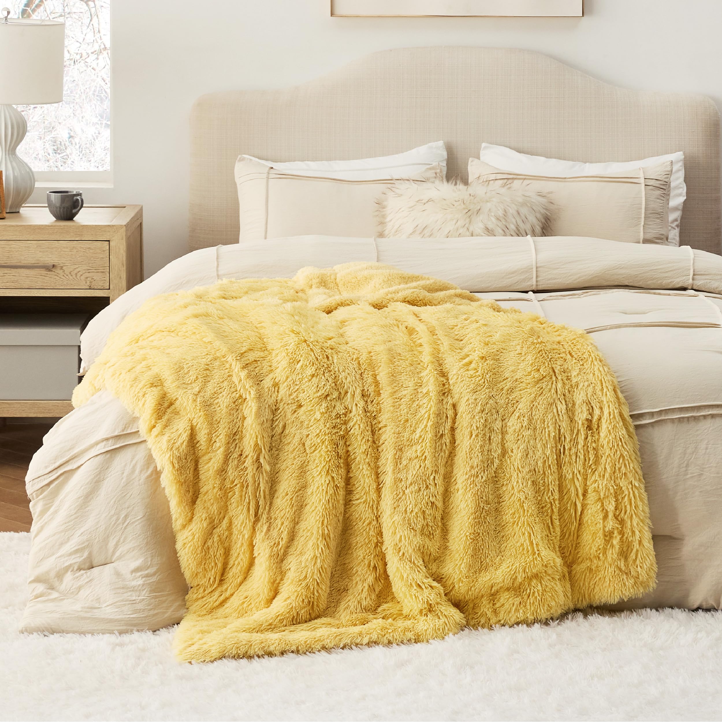 Bedsure blanket draped over sofa showing cozy living-room use