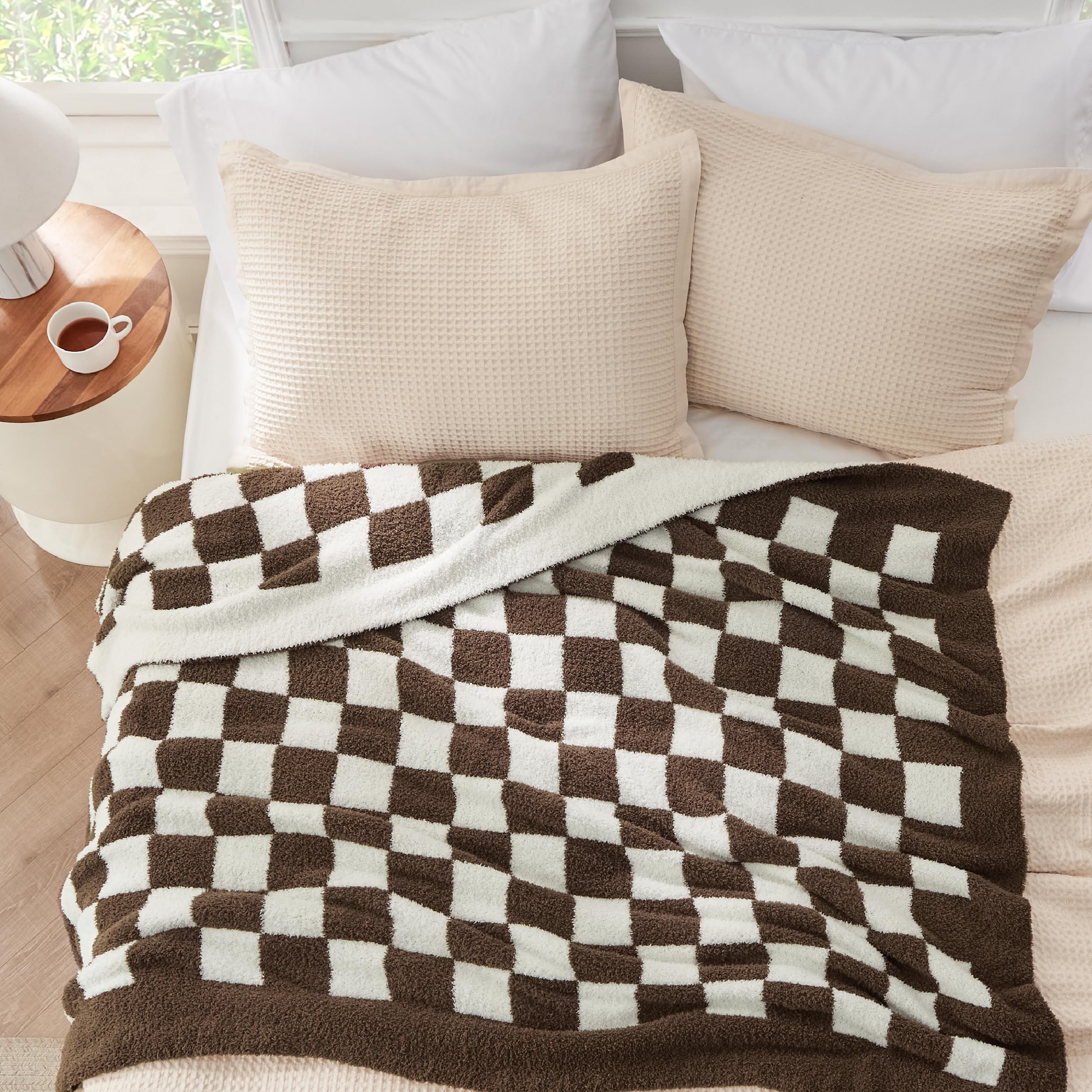 Bedsure throw in use on reading chair providing comfortable lap warmth