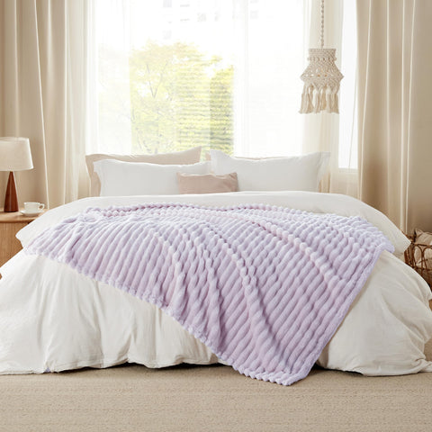 Bedsure throw rolled in travel bag highlighting portability and convenience