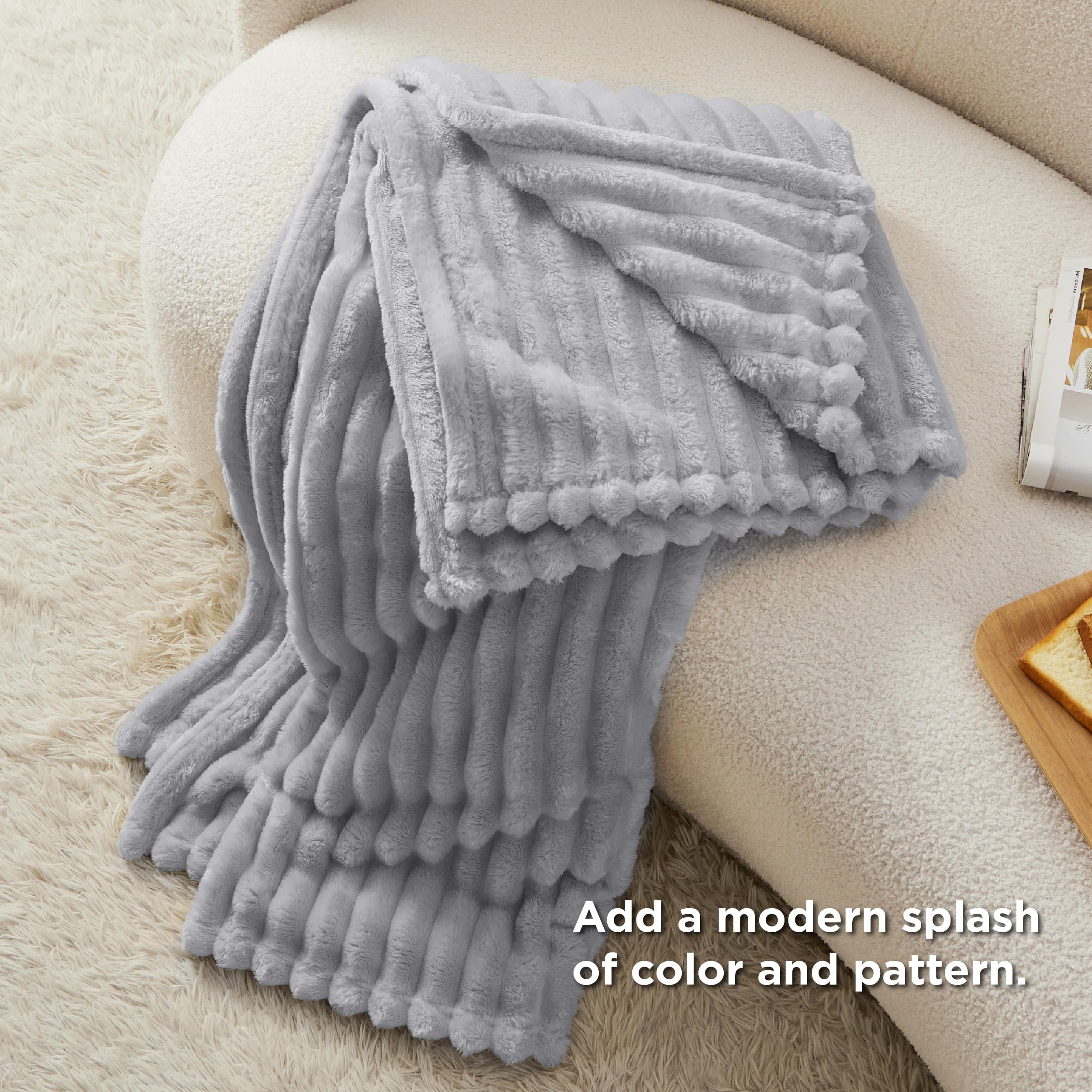 Bedsure throw beside chair illustrating 50x70 size scale