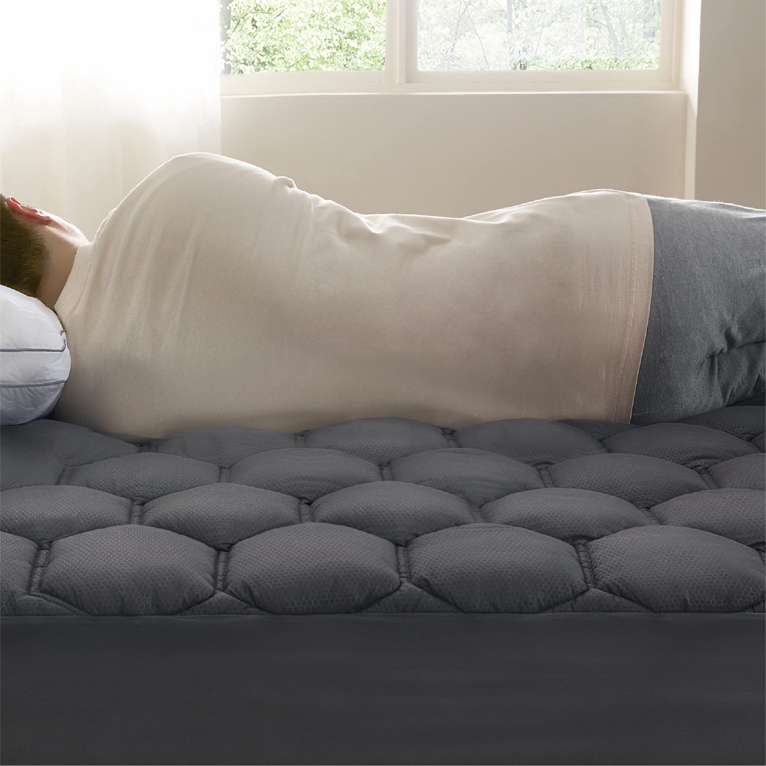 Bedsure side angle shows topper hugging mattress with elastic edging benefit