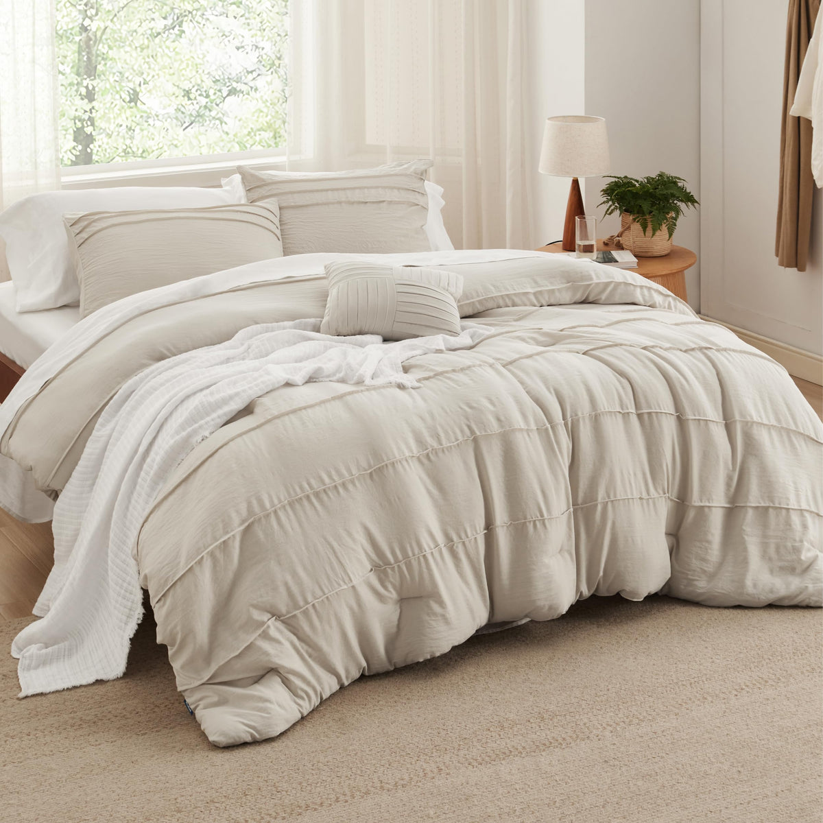 Bedsure twin XL front view showing beige pinch-pleat comforter and neat styling benefit