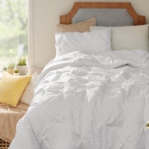 Bedsure set on Twin XL mattress illustrating correct fit and tidy coverage for dorm or apartment