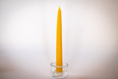 Bee The Light artisan hands dipping tapers demonstrating small-batch care