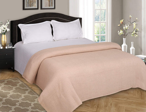 Belizzi Home blanket styled on a king bed demonstrating generous drape and layering