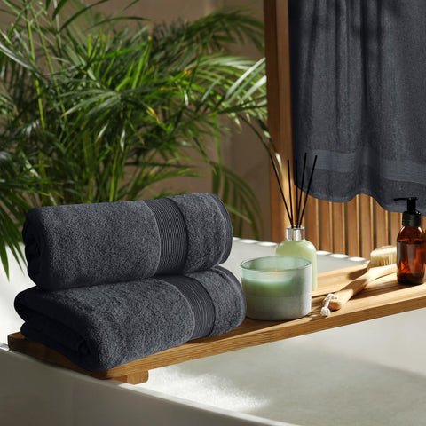 Belizzi Home stacked towels on vanity in bathroom, presents coordinated spa look