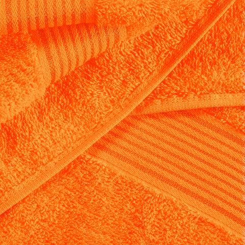 Belizzi Home folded oversized bath towel in orange highlighting size and soft appearance for full-body coverage