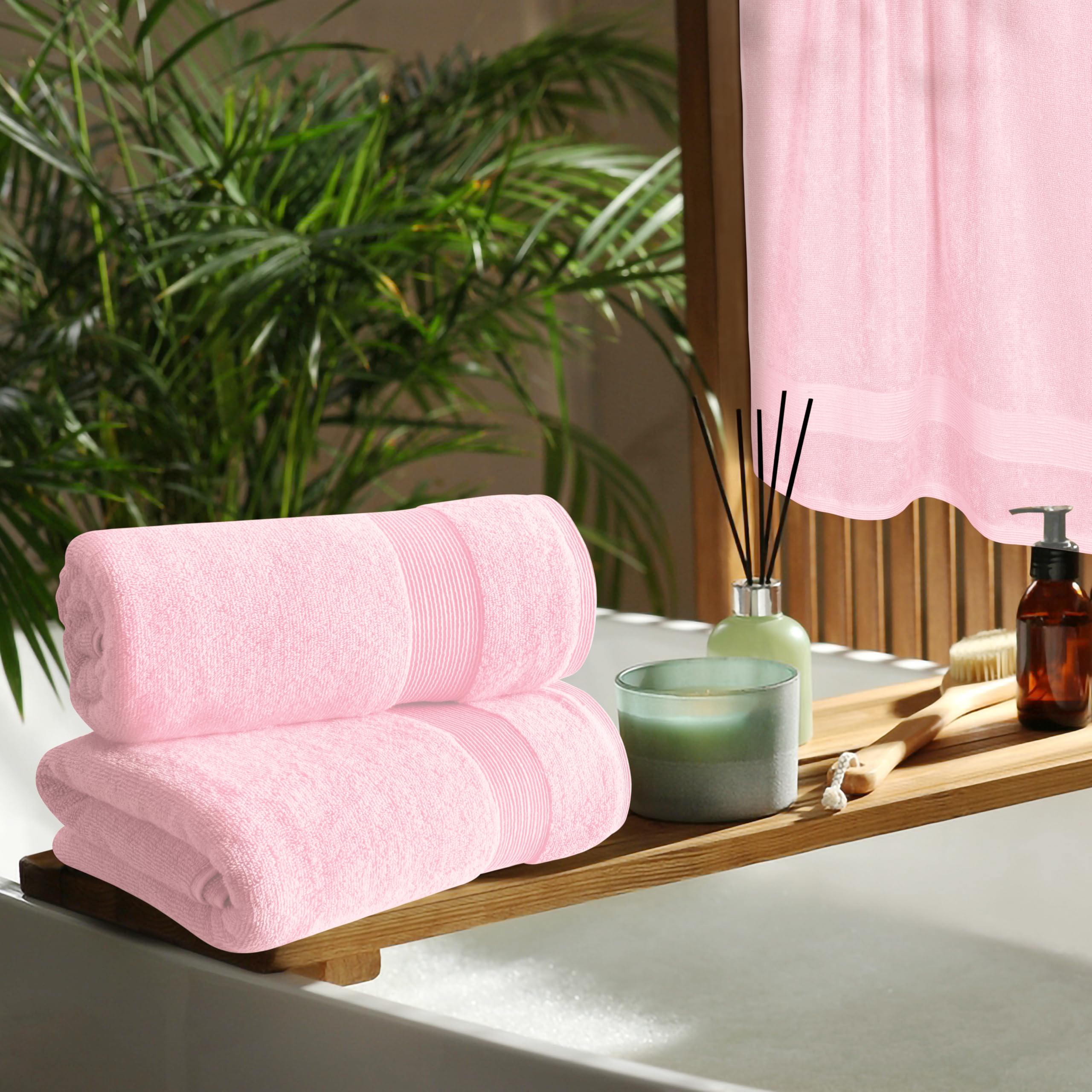 Belizzi Home towel next to faucet showing 27x54 inch scale and full coverage