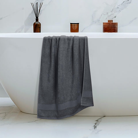 Belizzi Home towel being used to dry hands, demonstrates quick absorbency