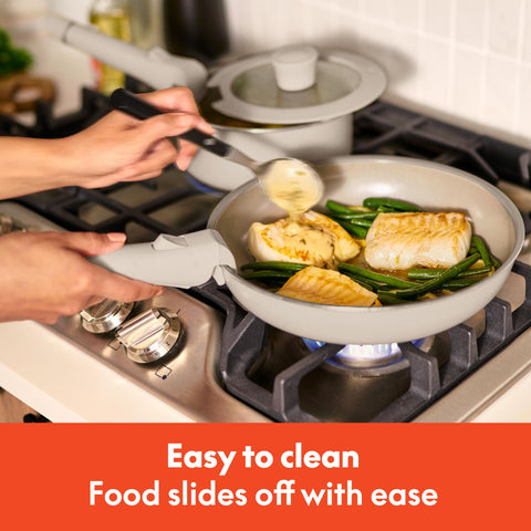 BELLA glass lid close-up with silicone rim showing secure fit and heat retention benefit