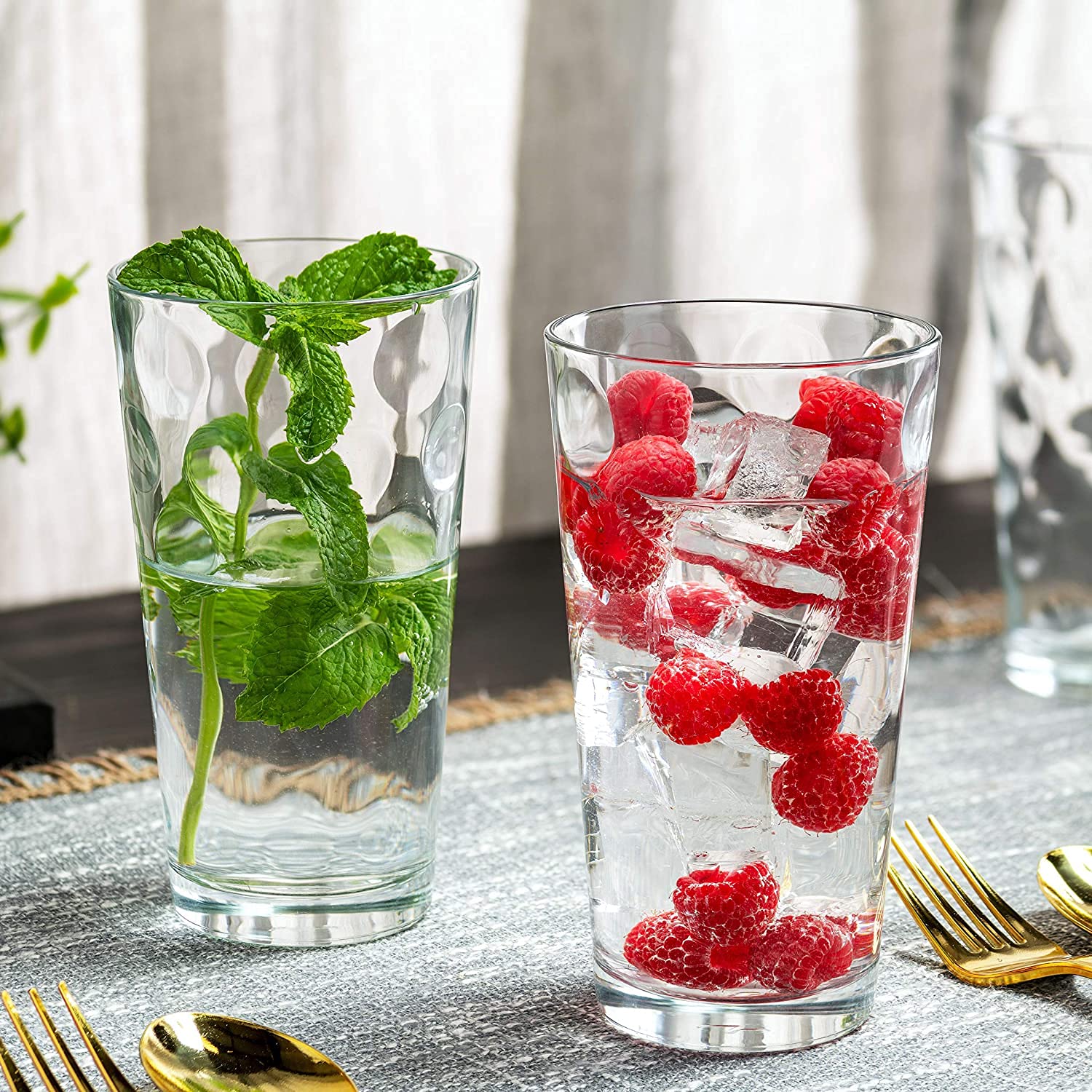 Bella Vino juice glass beside common items to show true size