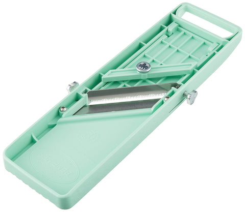 Benriner blade close-up highlighting sharp stainless-steel edge for precise cuts