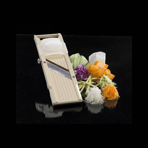 Benriner mandolin shown beside hand for scale demonstrating compact storage convenience