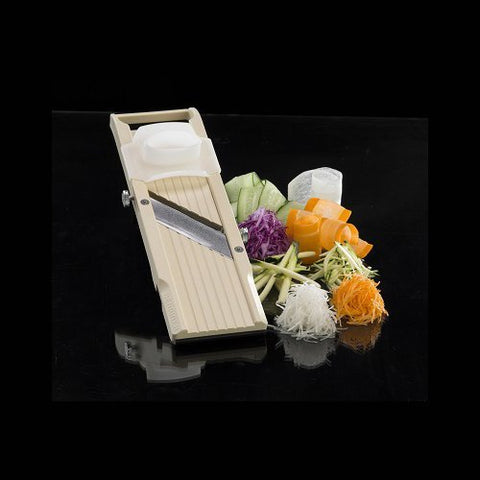 Benriner mandolin shown beside hand for scale demonstrating compact storage convenience