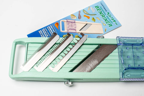 Benriner slicing carrots in use demonstrating fast, uniform vegetable slices