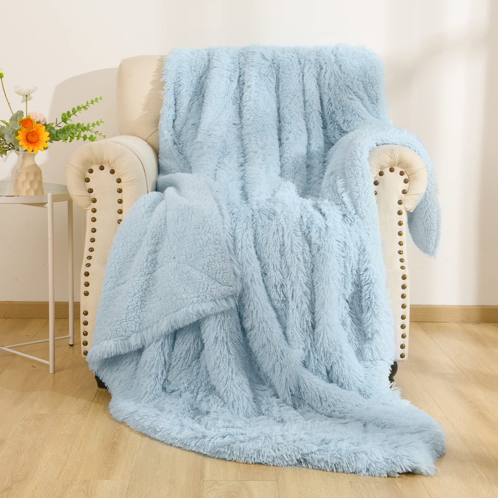 BENRON front folded throw showing neat edges and calm light blue tone for décor