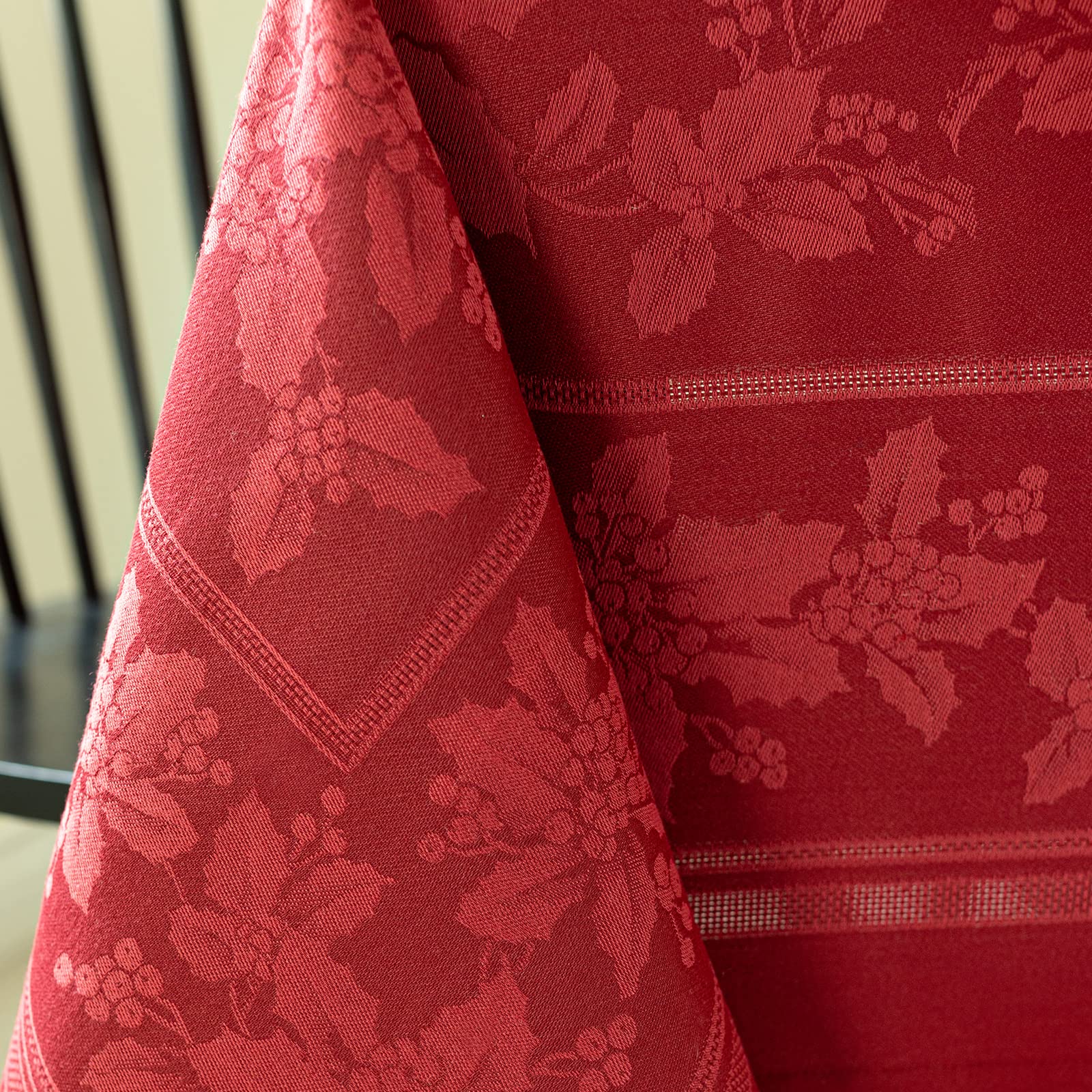 Benson Mills tablecloth draped on 60" x 84" rectangle table showing tailored fit and elegant drape