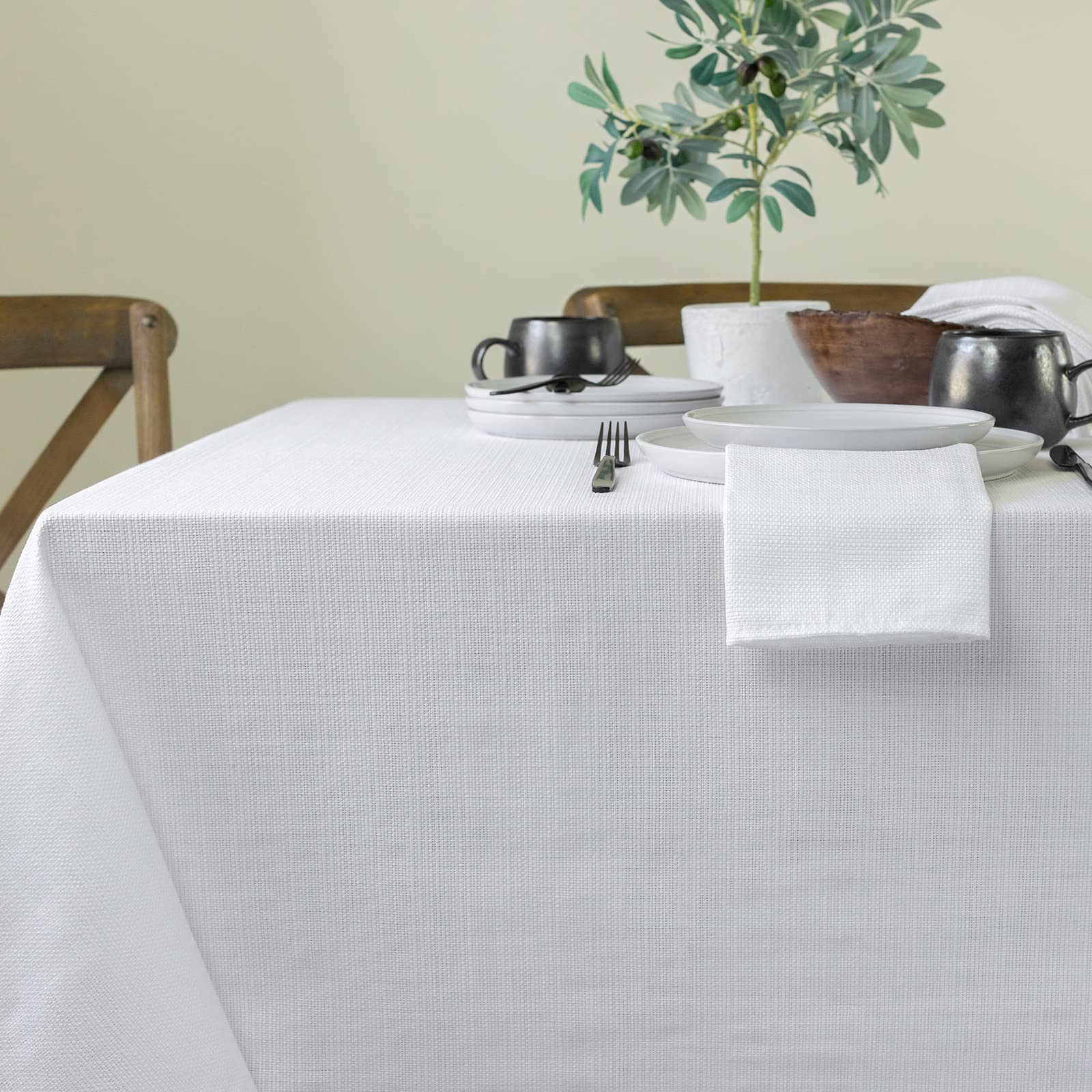 Benson Mills tablecloth scaled next to chair illustrating drop length and fit