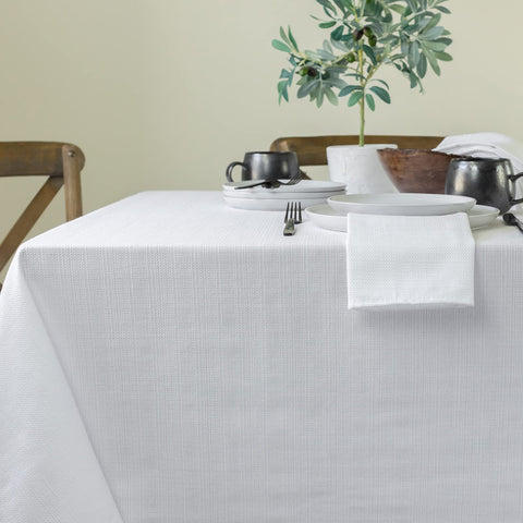Benson Mills tablecloth scaled next to chair illustrating drop length and fit
