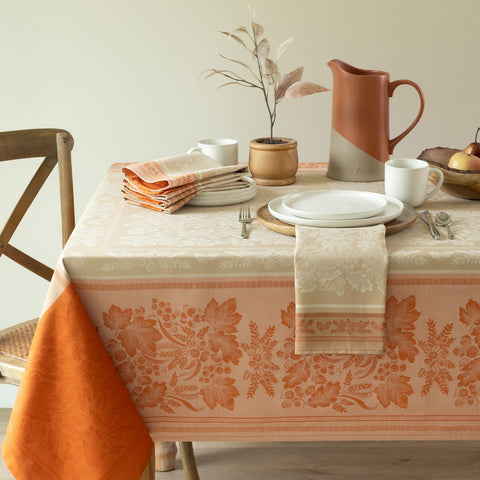 Benson Mills front view of full golden rust tablecloth adds warm autumn ambiance