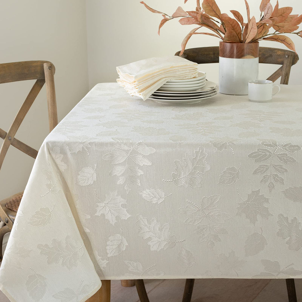 Benson Mills front view ivory tablecloth showcasing fall motifs and elegant sheen