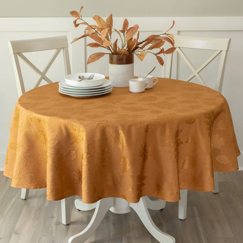 Benson Mills front view of amber-bronze round tablecloth enhancing an autumn table