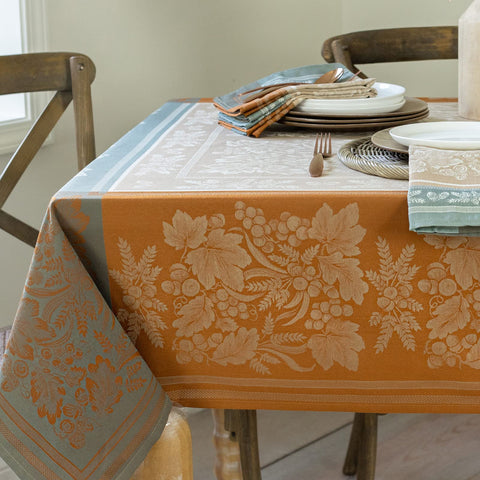 Benson Mills front view of taupe jacquard tablecloth showing full pattern and fit