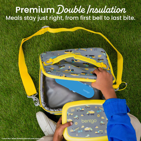 Bentgo exterior pocket holding ice pack to keep food cool