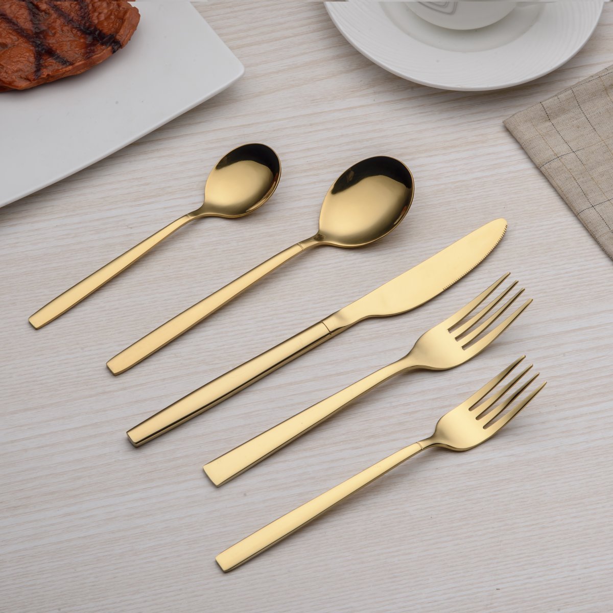 Berglander flatware styled on a dining table adding warmth and sophistication