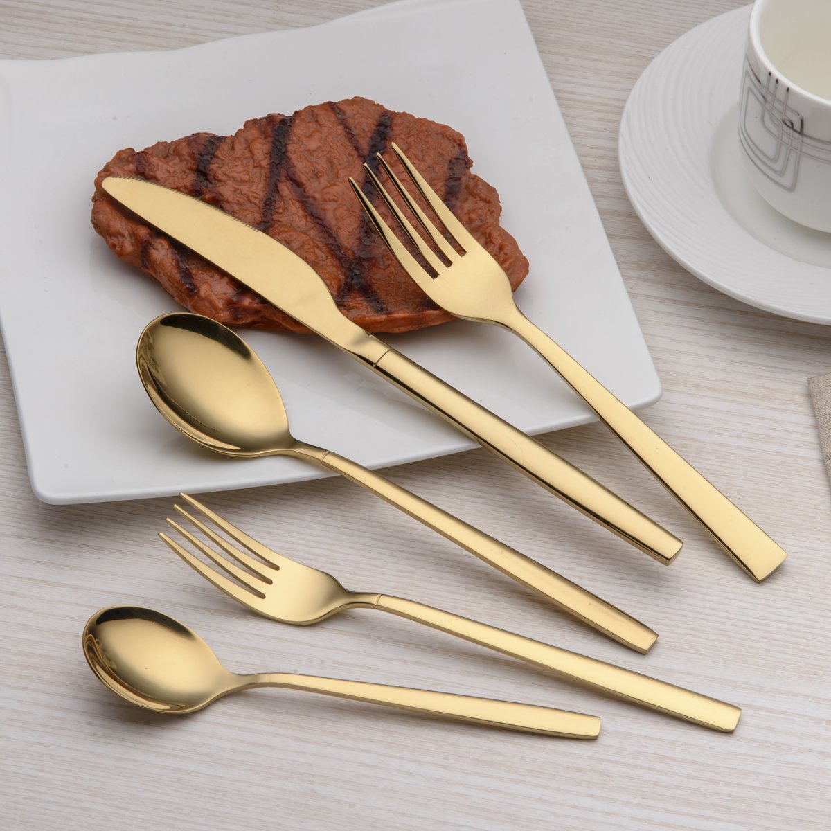Berglander fork close-up showing polished gold finish and comfortable grip